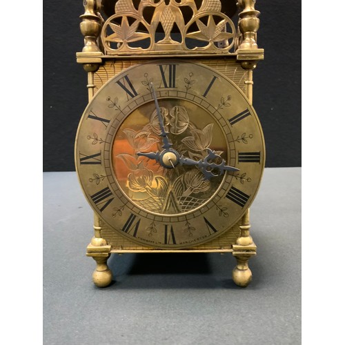 173 - A 17th century style brass lantern clock, retailed by Finnigan's, Manchester, 30cm high