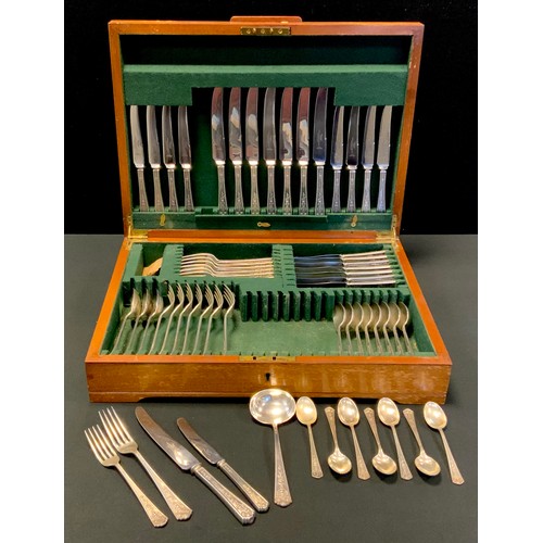 109 - A silver canteen, for eight, comprising sauce ladle, four table spoons, dinner knives and forks, des... 