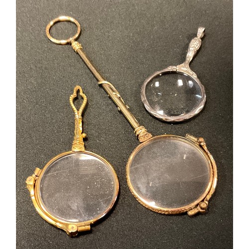 106 - A pair of 19th century gilt metal lorgnette, the haft with gold salamander, 15cm long, Christies 3rd... 