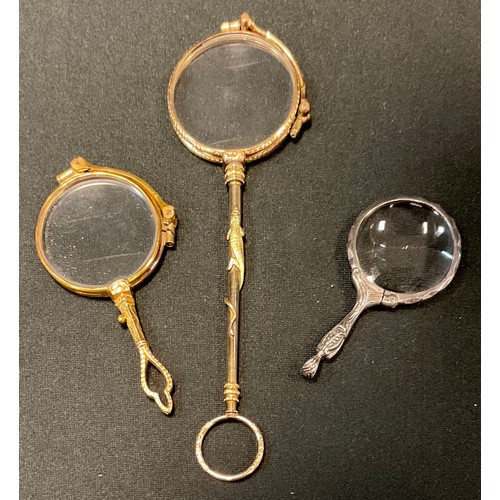 106 - A pair of 19th century gilt metal lorgnette, the haft with gold salamander, 15cm long, Christies 3rd... 