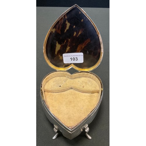 103 - An Edwardian  silver and tortoiseshell heart shaped jewellery box,  inlaid with silver ribbon tied s... 