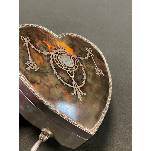 103 - An Edwardian  silver and tortoiseshell heart shaped jewellery box,  inlaid with silver ribbon tied s... 