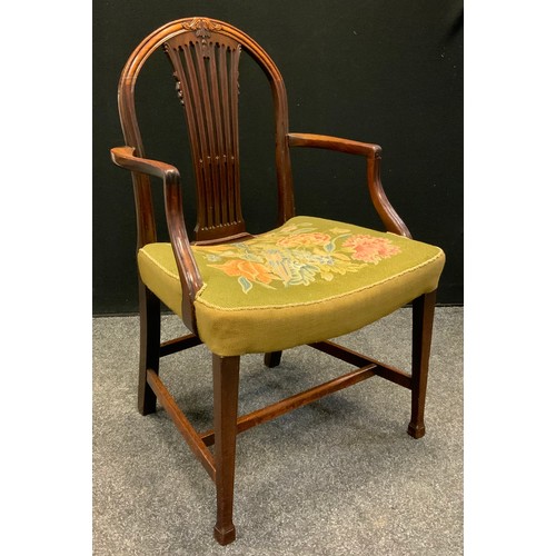 126 - An early George III Hepplewhite design mahogany elbow chair, arched back,  tapestry upholstered seat... 