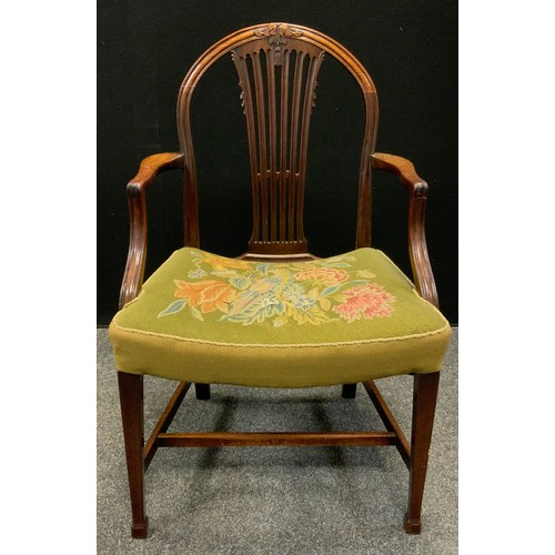 126 - An early George III Hepplewhite design mahogany elbow chair, arched back,  tapestry upholstered seat... 