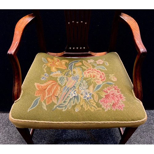 126 - An early George III Hepplewhite design mahogany elbow chair, arched back,  tapestry upholstered seat... 