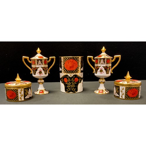 202 - A pair of Abbeydale Chrysanthemum pattern two handled pedestal trophy cups and covers, 16.5cm high, ... 