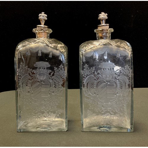 219 - A pair of 18th century continental Armorial rounded square clear glass decanters, rounded shoulders ... 