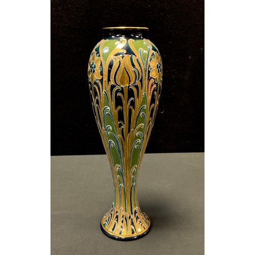 38 - A Mcintyre Florian Ware slender ovoid vase, tube lined with tulips and flowers in gilt, with sinuous... 