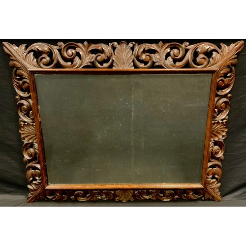 177 - A 19th century carved oak wall mirror, shell and scroll frame, 104cm high, 80cm wide