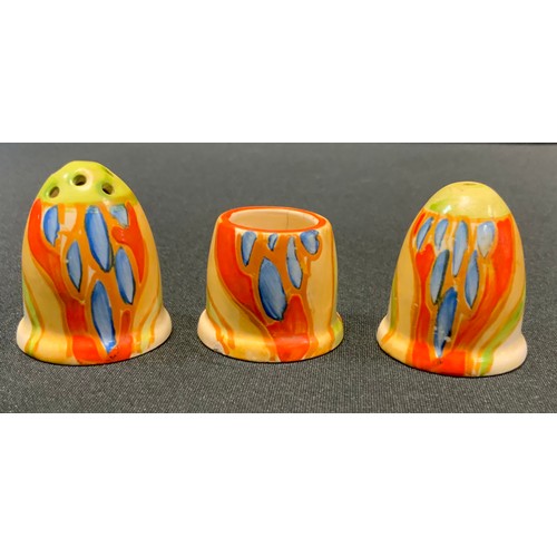 53 - A Clarice Cliff Bizarre Windbells pattern three piece thumb nail cruet set, with blue lenticular fol... 