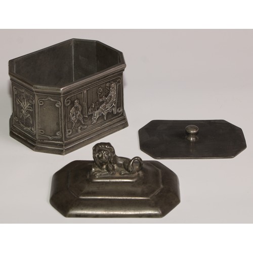 15 - A lead canted rectangular tobacco box, the sides in relief with gentlemen smoking clay pipes, the co... 