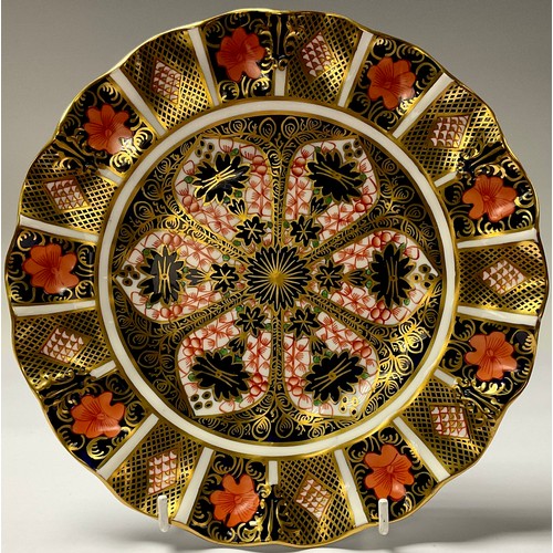 19 - A Royal Crown Derby 1128 Imari pattern shaped circular plate, 22cm diameter, first quality; an 1128 ... 