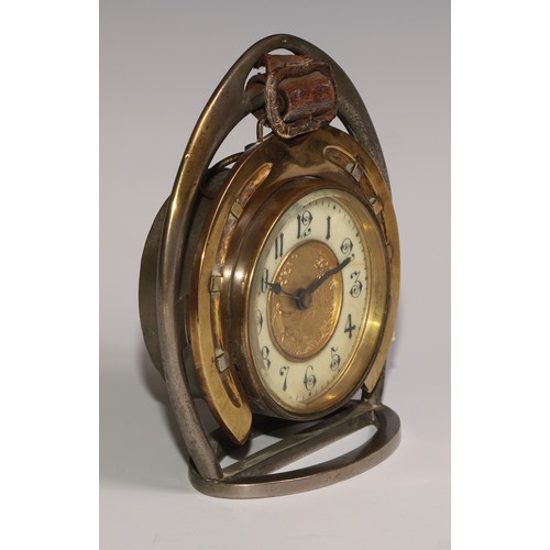 59 - A late Victorian novelty timepiece, of equestrian interest as horseshoe within a riding stirrup, the... 