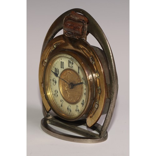 59 - A late Victorian novelty timepiece, of equestrian interest as horseshoe within a riding stirrup, the... 