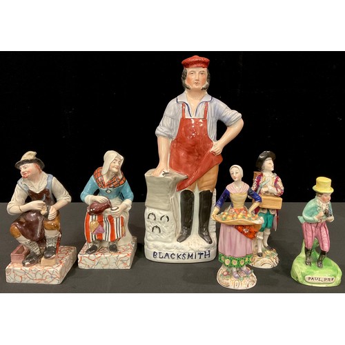 67 - A 19th century Staffordshire figure, of a blacksmith; another, Paul Pry; a pair of figures, cobbler ... 