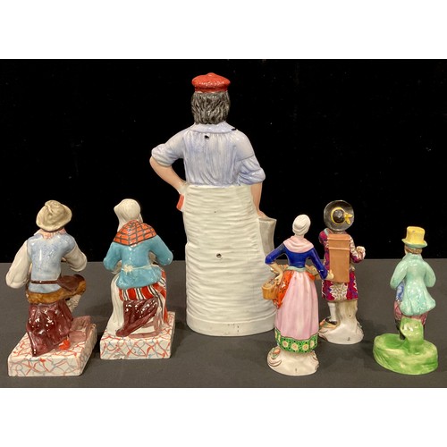 67 - A 19th century Staffordshire figure, of a blacksmith; another, Paul Pry; a pair of figures, cobbler ... 