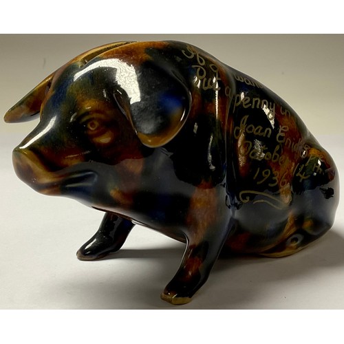 69 - A Denby majolica pig money box, seated, 9cm high, inscribed in gilt, If you want me to be chummy, Pu... 