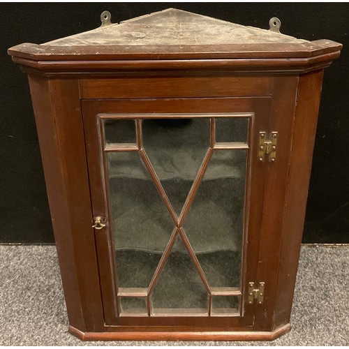 216 - A small George III mahogany glazed corner cabinet, single astragal glazed door, H hinges, 69cm high,... 