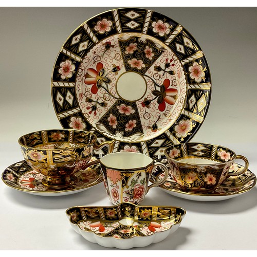 74 - A Royal Crown Derby 2451 Imari pattern teacup and saucer; another similar; a 2451 pattern plate, 24c... 