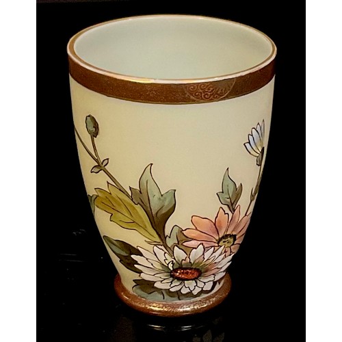 79 - A late 19th century Japonesque opaque glass beaker, enamelled with chrysanthemum, Satsuma style band... 