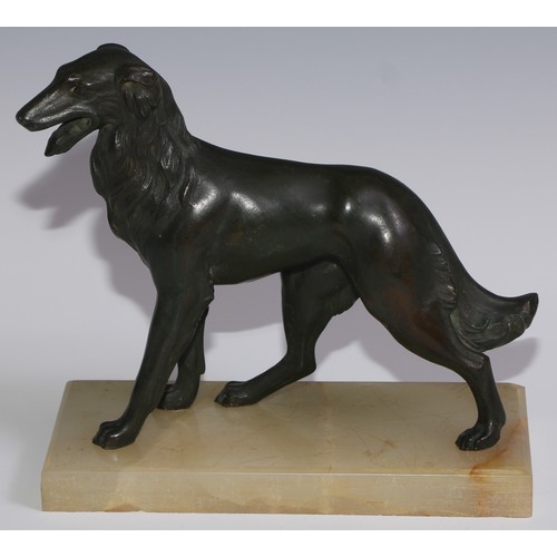 94 - An Art Deco spelter model, of a dog, green onyx base, 21cm long