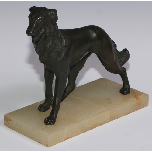 94 - An Art Deco spelter model, of a dog, green onyx base, 21cm long