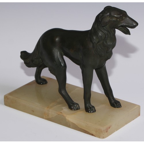 94 - An Art Deco spelter model, of a dog, green onyx base, 21cm long