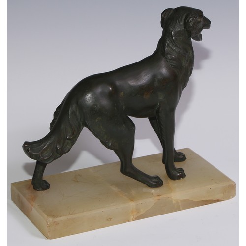 94 - An Art Deco spelter model, of a dog, green onyx base, 21cm long