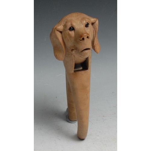 95 - Nutcrackers - a Black Forest linden wood novelty lever action nutcracker, carved as the head of dog,... 