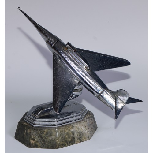 97 - A mid-20th century chrome table lighter, as a fighter jet, marble base, 24cm long; an Art Deco style... 