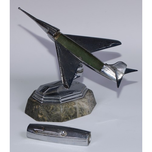 97 - A mid-20th century chrome table lighter, as a fighter jet, marble base, 24cm long; an Art Deco style... 