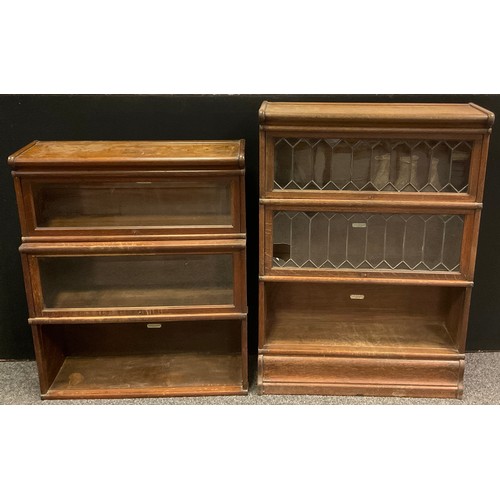 214 - A Globe Wernicke oak three tier stacking bookcase. the top two tiers with leaded glass doors, 121cm ... 