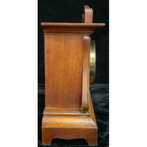 123 - A continental Art Nouveau mahogany mantel clock, arched case worked with tooled scrolling stems, sil... 