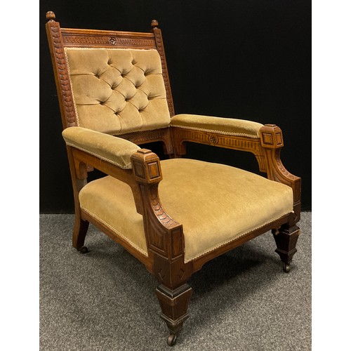 191 - A late Victorian carved oak arm chair, carved detailing, buttoned back, stuffed over seat,  upholste... 