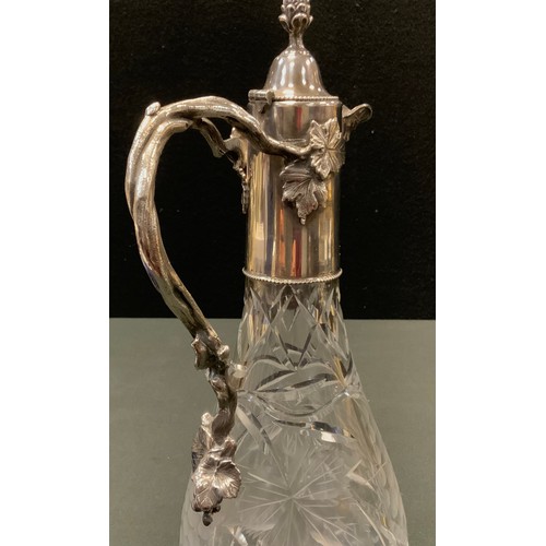 133 - An E.P.N.S mounted cut glass claret jug, cut with fruiting vine, hinged cover with bud finial, vine ... 