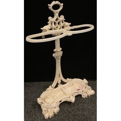 179 - An early 20th century cast iron walking stick/umbrella stand, leafy scrolling framework and borders,... 