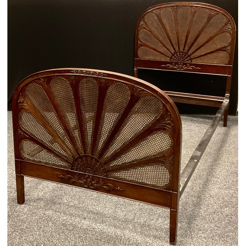 186 - An early 20th century mahogany framed bergere caned single bed, Fan shaped head and foot boards, 119... 