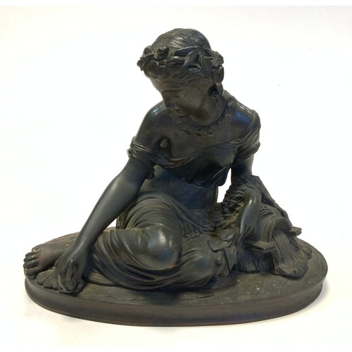 144 - French School (19th century), a dark patinated bronze, of a Classical muse, oval base, 23.5cm wide