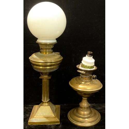 235 - An early 20th century brass table oil lamp, fitted for electricity; another (2)