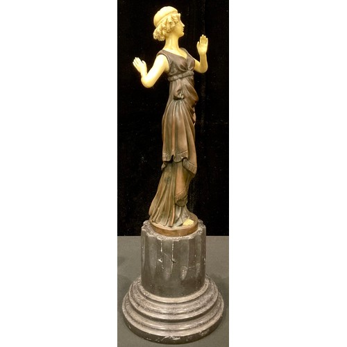 253 - An Art Deco style bronzed metal sculpture, Flapper Girl, 43cm high