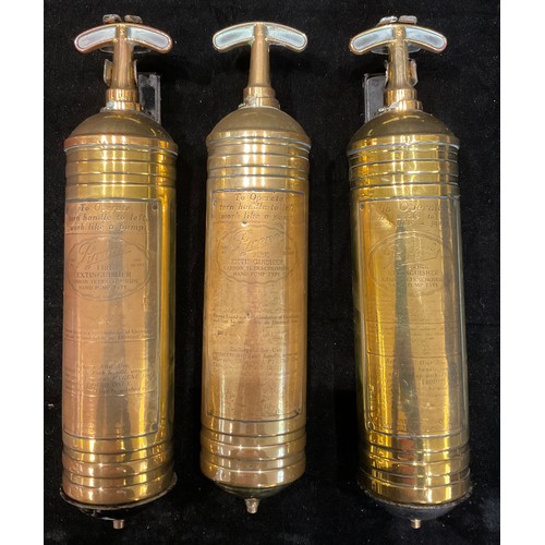 254 - A brass Pyrene hand pump fire extinguisher, on wall bracket; others (3)