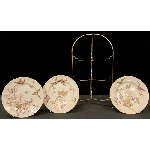 255 - An Olde Hall folding cake stand, with three Continental tea plates