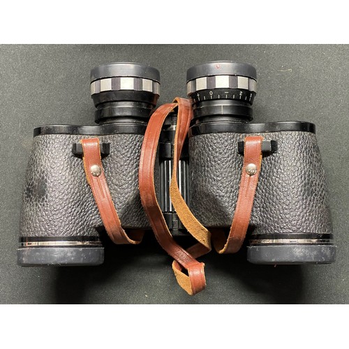 260 - A black Bakelite telephone; binoculars by Goldenline 10x25; binoculars by Swift 7 x .35; binoculars ... 