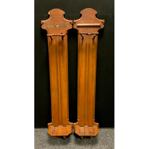 181 - A pair of 19th century French painted oak gun racks, shaped back boards, each fitted for two weapons... 