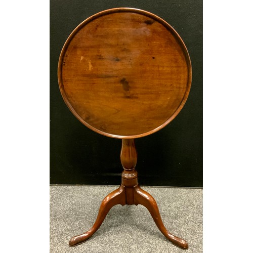 110 - A George III mahogany circular dish top occasional table, turned baluster columns, tripod vase, pad ... 