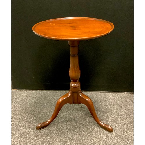 110 - A George III mahogany circular dish top occasional table, turned baluster columns, tripod vase, pad ... 