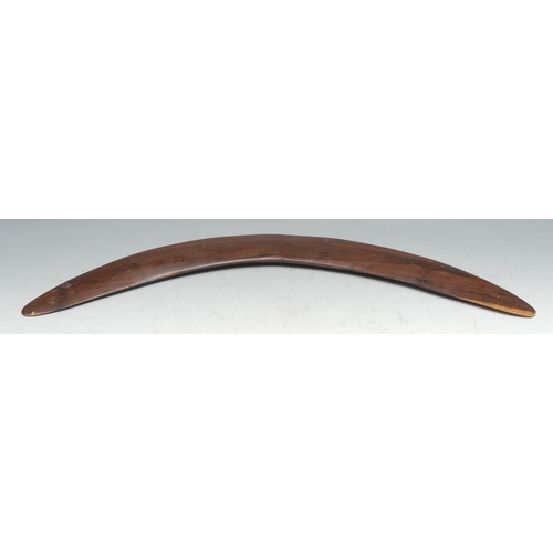 329 - An Australian Aboriginal boomerang, carved with kangaroos and emus, 55cm long