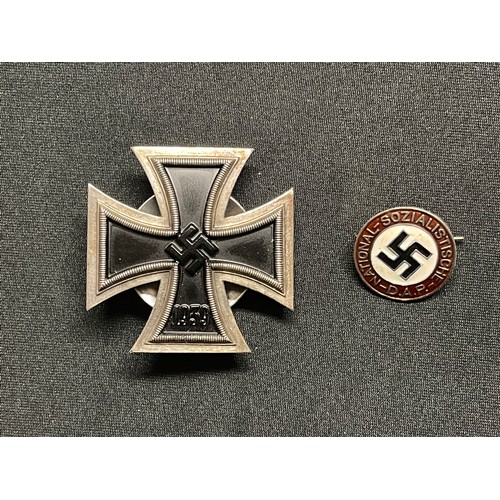 342 - Reproduction WW2 Third Reich Iron Cross 1st class. One piece construction. Screwback with maker mark... 