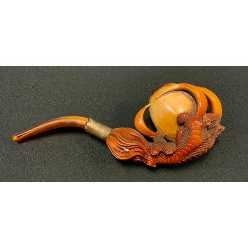 234 - A 19th century meerschaum pipe, carved as a dragon's claw grasping a pearl of wisdom, 17.5cm long, c... 