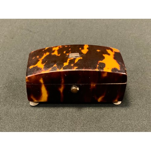 232 - A Victorian tortoiseshell trinket box, the cover slightly domed, bone bun feet, 6.5cm wide, 2.5cm hi... 